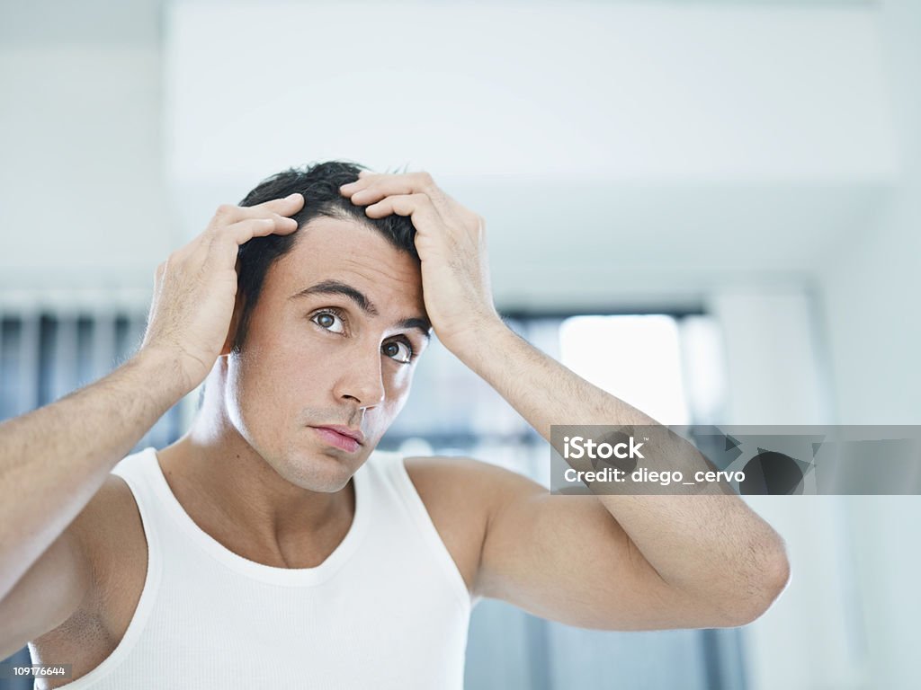 male beauty caucasian adult man checking hairline. Horizontal shape, head and shoulders, front view, copy space Men Stock Photo