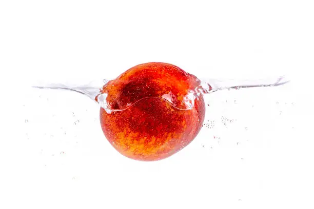 Photo of Fresh peach in the water