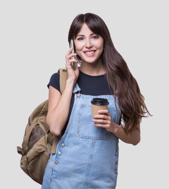 istock Happy young student girl talking on smart phone 1091773754