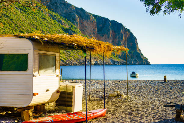 istock Caravan trailer on sunny beach 1091779760