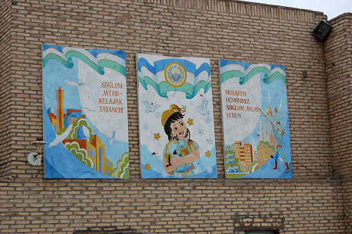 Bukhara a wall wth three nice plakats. The Image was captured during Spring Season