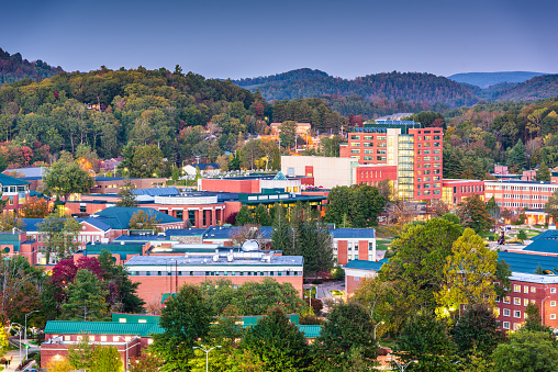 Boone, North Carolina, USA campus and town skyline at twilight.