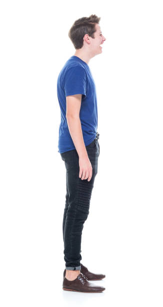 istock Young high school age male with hands by side 1091786968