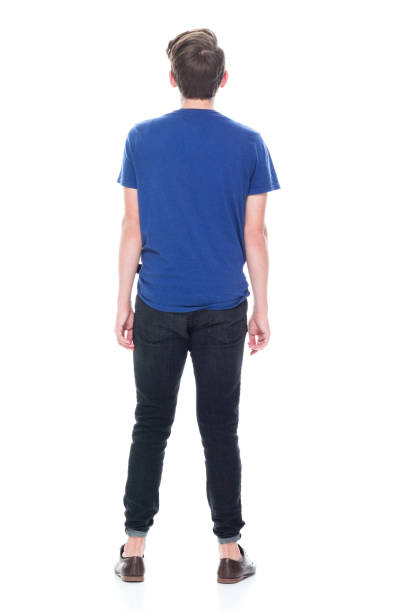istock Young high school age male with hands by side 1091787054
