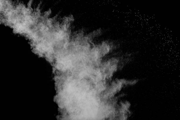 istock Bizarre forms of white powder explosion cloud against black background.White dust particles splash. 1091788412