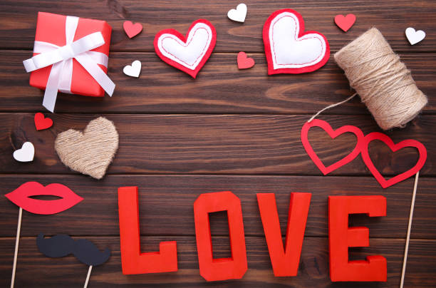istock Valentine's day background with decoration on brown background. 1091795972