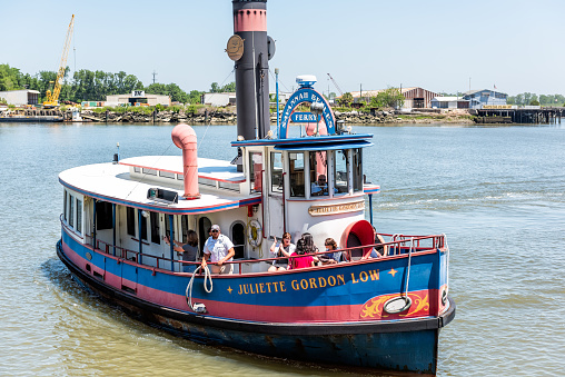 Savannah, USA - May 11, 2018: Old town River in Georgia famous southern town with closeup of Juliette Gordon Low Belles ferry