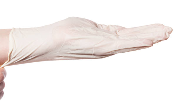 istock side view of hand pulls latex glove on palm 1091797054