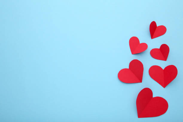 istock Valentines day greeting card. Handmaded red hearts on blue background. 1091797426