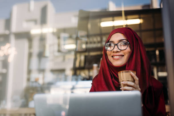 istock Beautiful muslim woman relaxing at cafe 1091798024