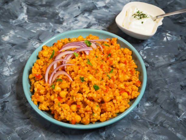 istock Turkish bulgur pilaf with chickpeas and tomatoes. 1091798162