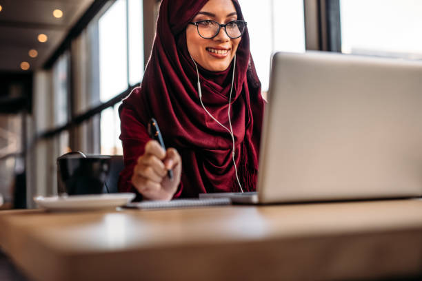 istock Muslim woman having video chat at cafe 1091799556