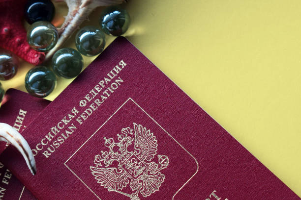 istock travel Documents. Passport on a yellow background. Decorative seashells and pearls. 1091799710