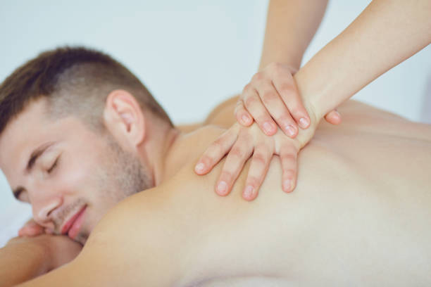 istock Back massage for a man lying on the table in the spa salon 1091799940