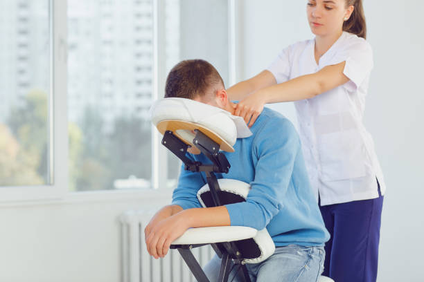 istock Massage on the massage chair in the office. 1091799954
