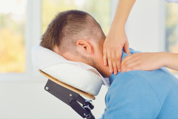 Massage on the massage chair in the office. stock photo