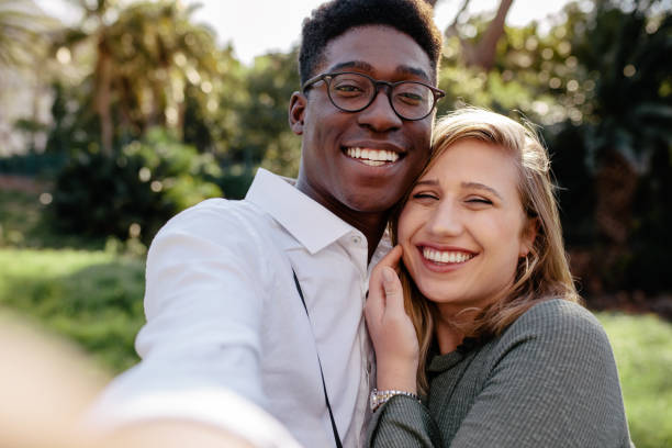 istock Beautiful interracial couple making a selfie 1091802792