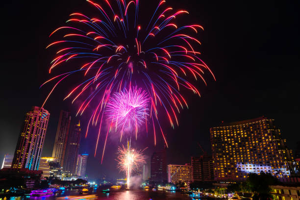 istock Beautiful firework display for celebration happy new year and merry christmas with  Twilight night and firework lighting in bangkok cityscape background, Thailand. 1091804788