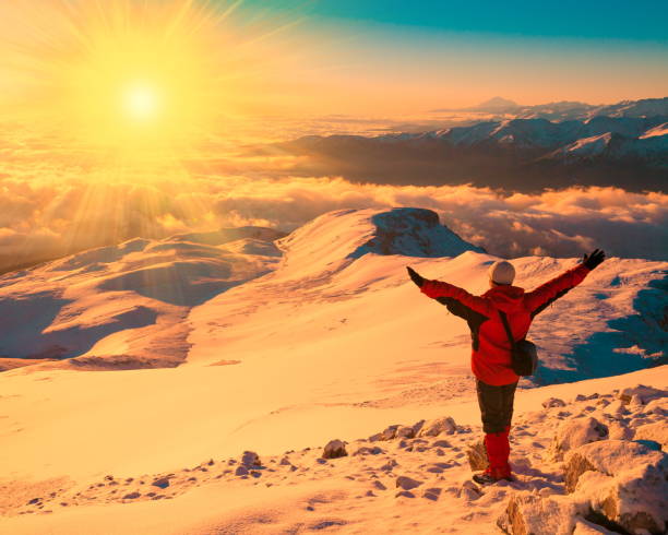 istock A man in mountain sunset winter. Unique. Sunny rays. Christmas 1091809062