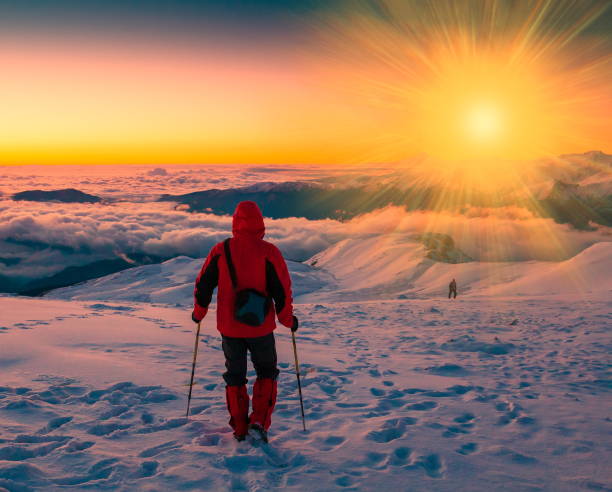 istock A man in mountain sunset winter. Unique. Sunny rays. Christmas 1091809106