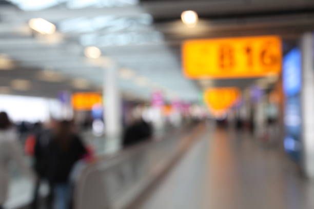 istock Defocused airport passengers crowd walking blurred people 1091809452