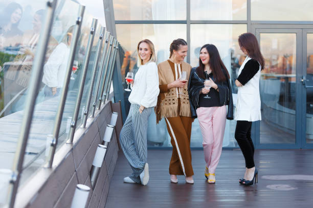 istock Four female celebrate a corporate party 1091817324