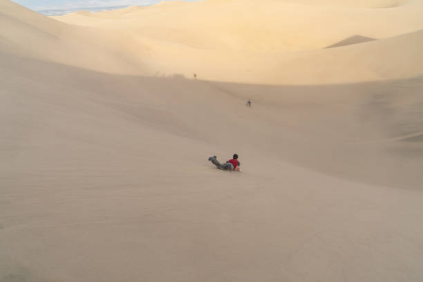 istock Skateboarding fun on Huacachina Sand Dunes 1091822090