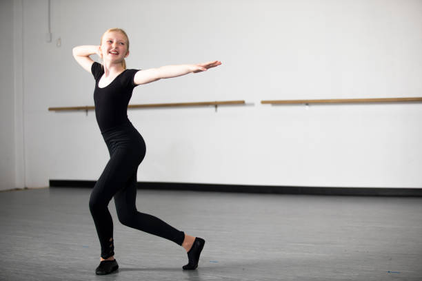 Diverse Young Girls Practicing Musical Theatre Dance in Studio A Diverse group of Young Students Practicing Musical Theatre Dance in Studio jazz dancing stock pictures, royalty-free photos & images