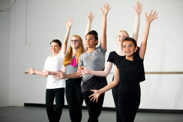 Diverse Young Students Practicing Musical Theatre Dance in Studio A Diverse group of Young Students Practicing Musical Theatre Dance in Studio theater class stock pictures, royalty-free photos & images