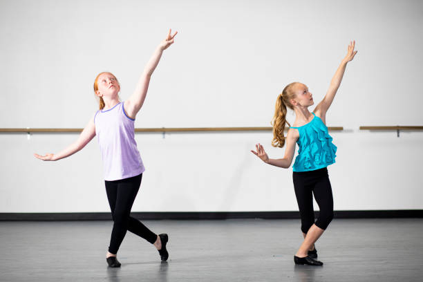 young girls practicing musical theatre dance in studio - jazz ballet imagens e fotografias de stock