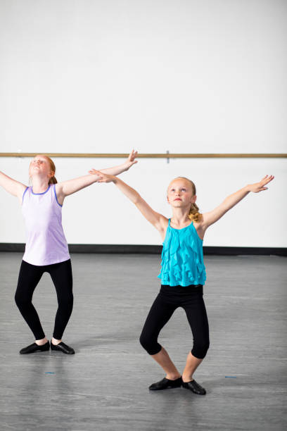 istock Young Girls Practicing Musical Theatre Dance in Studio 1091827602