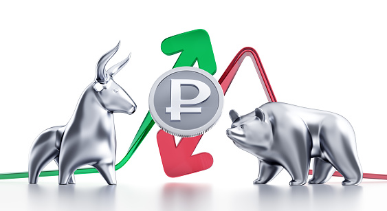 Currency coin of the Ruble in between of metallic statuettes of a bull and a bear in front of trending arrows. 3D rendering graphics.