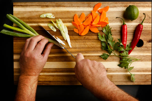istock Plan view of hands chopping a variety of vegetables 1091828890