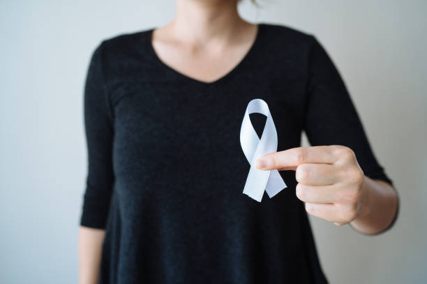 istock Young woman with white awareness ribbon 1091830698