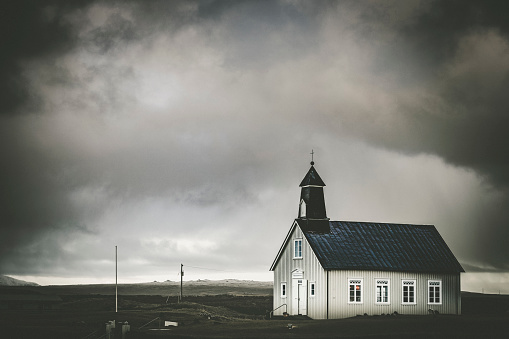 strandarkirkja church at the coastline in south iceland.