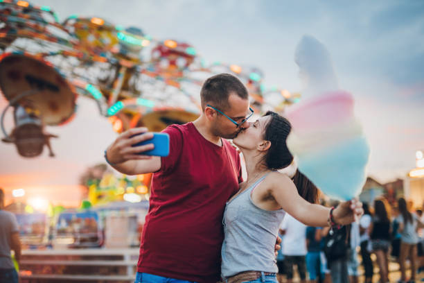 istock Couple making selfie in amusement park 1091842196
