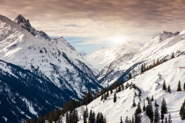 Fantastic evening winter landscape. Colorful overcast sky. Austria, Europe. Beauty world.