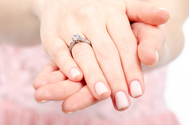 istock Woman hand a ring of gold silver beauty 1091844588