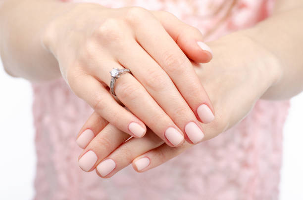 istock Woman hand a ring of gold silver beauty 1091844592