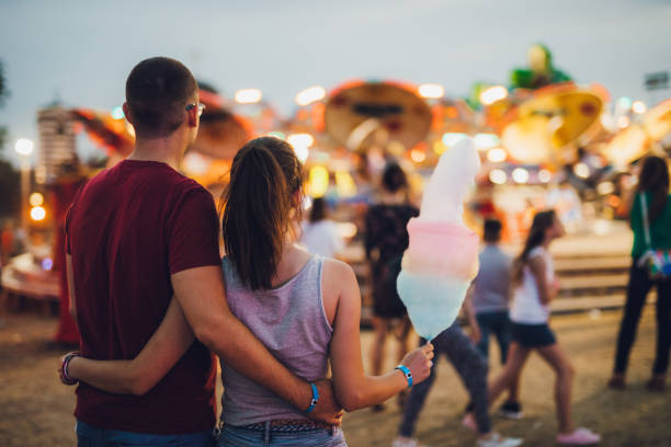 istock Young couple in amusement park 1091844792