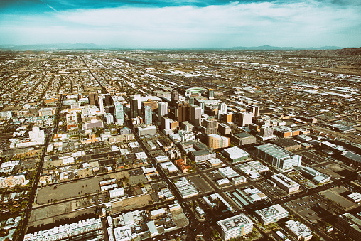 The downtown and surrounding areas of Phoenix, Arizona from about 2000 feet in altitude processed in an aged film method for a retro style.