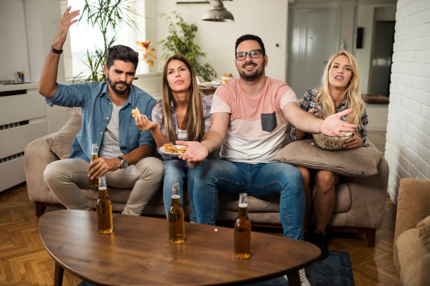 istock Friends watching sport on tv. 1091855018