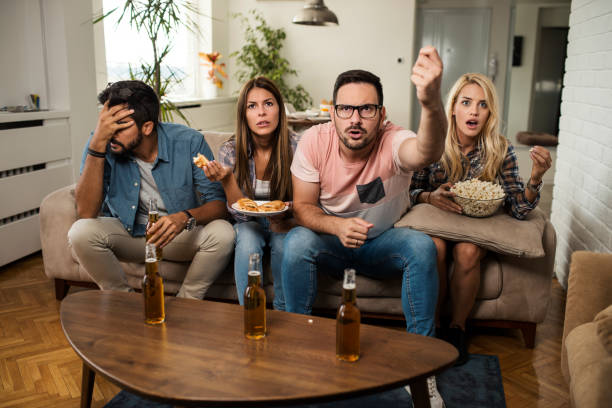 istock Friends watching sport on tv. 1091857222