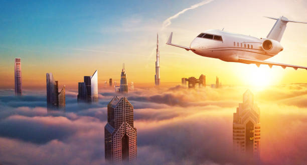 istock Private jet plane flying above Dubai city 1091860998