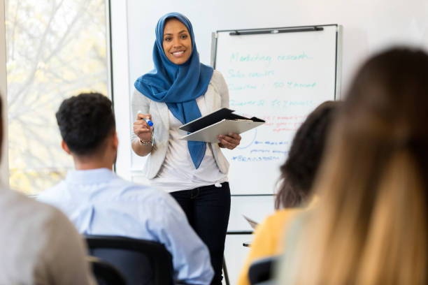 istock Muslim businesswoman teaches employee training class 1091866190