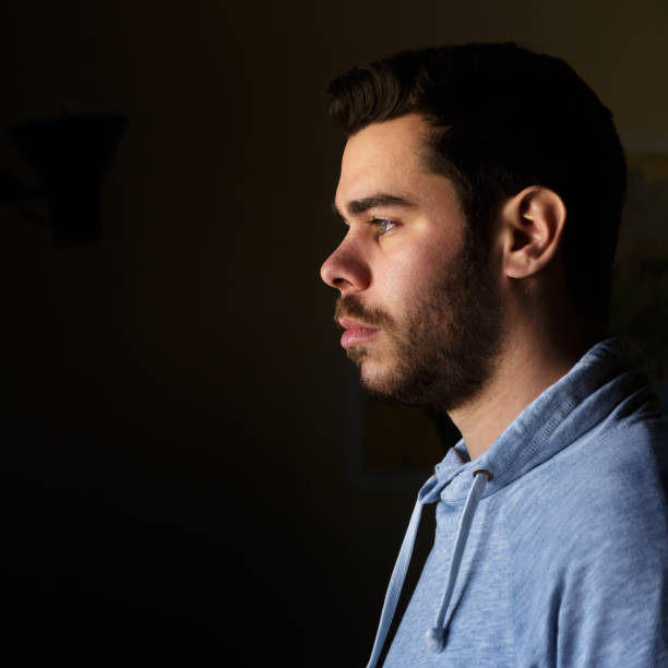 istock Portrait of a young man with a beard in profile 1091866684