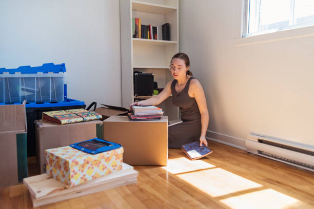 istock Millennial young woman moving in new apartment. 1091868310