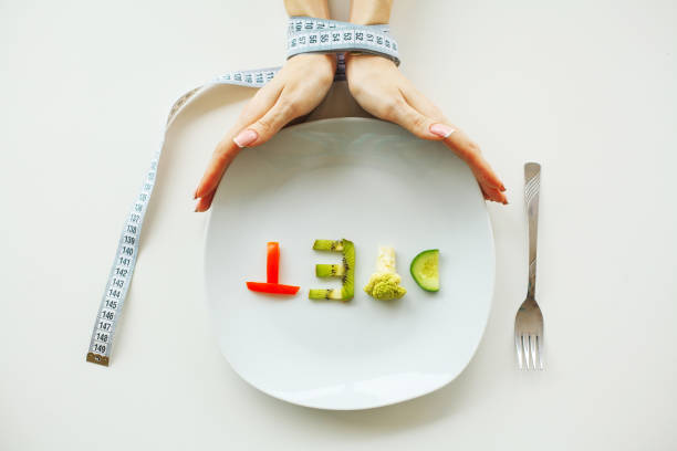 istock Diet. Close up of plate with vegetable diet letters 1091870458