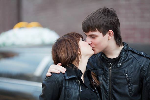 Kiss Against A Wedding Stock Photo - Download Image Now - Adult
