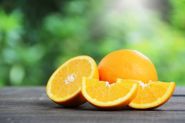 istock Fresh oranges fruit slice on wooden table. 1091872752